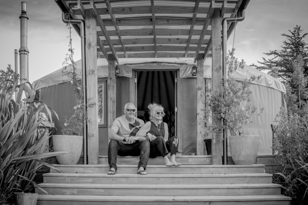 Pete and Freddie sitting in front of Yurt on York looking off into the distance. Black and White.